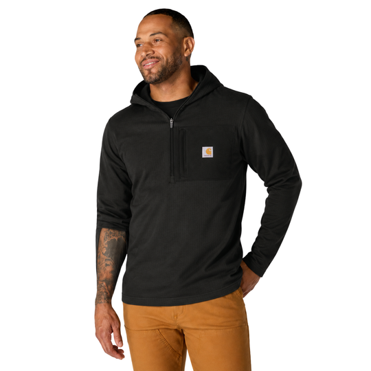 Man wearing a black Carhartt hoodie on a white background