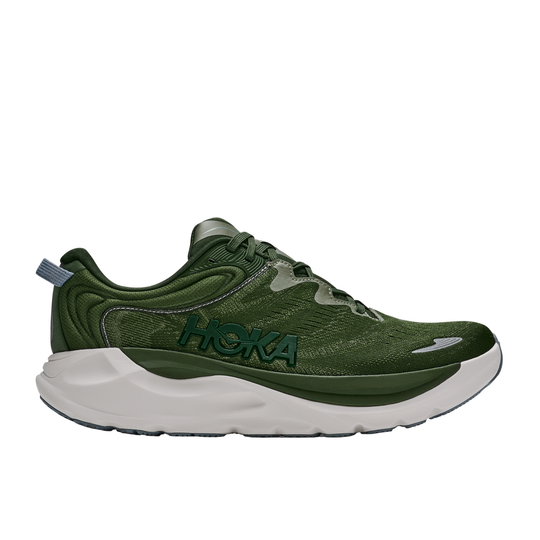 Green running shoe with white sole on a white background
