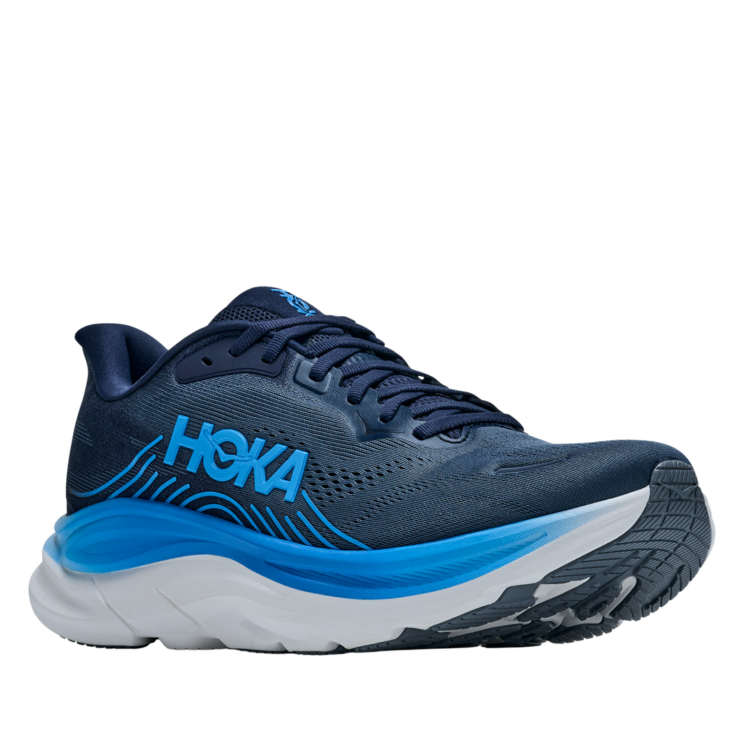 Blue running shoe with white sole on a white background