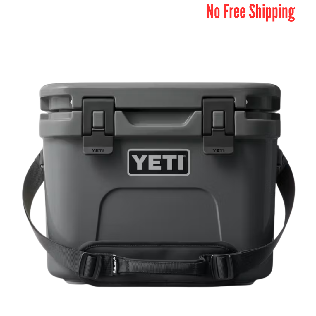Dark gray hard cooler with black latches, shoulder strap, and a front logo patch