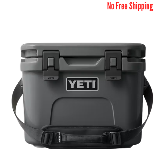 Dark gray hard cooler with black latches, shoulder strap, and a front logo patch