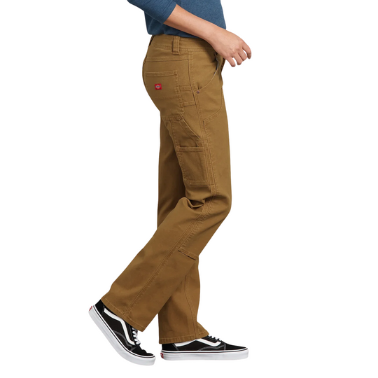 Dickies Women's Flex Relaxed Fit Duck Carpenter Pants - Rinsed Brown Duck on a female model on a white background.