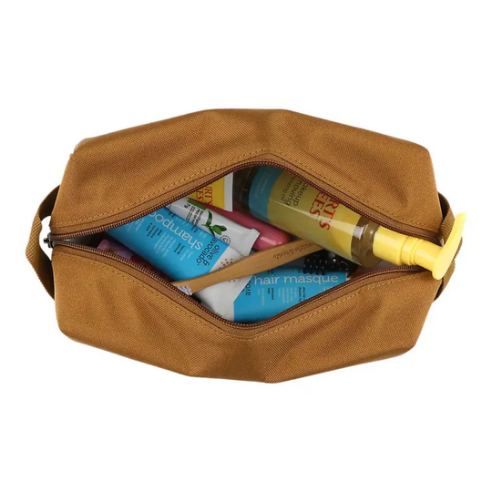 Carhartt Travel Kit - Carhartt Brown on a white background. Open zipper with items in bag.