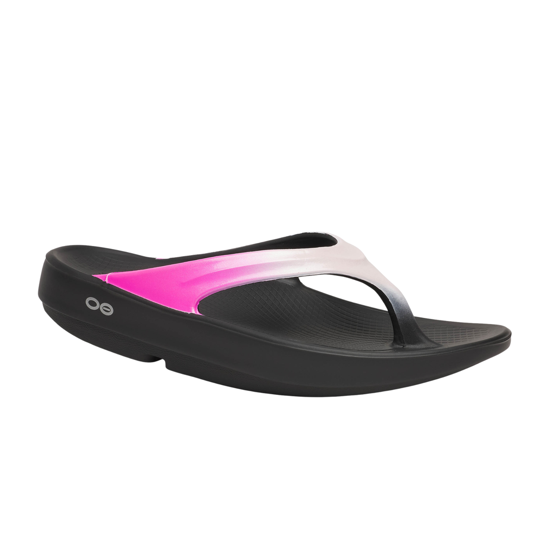Black sandal with pink interior on a white background