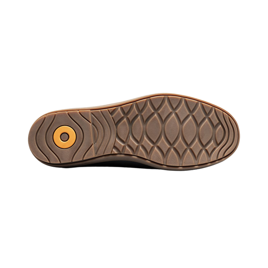 Brown boot outsole with molded tread and a yellow circular heel insert