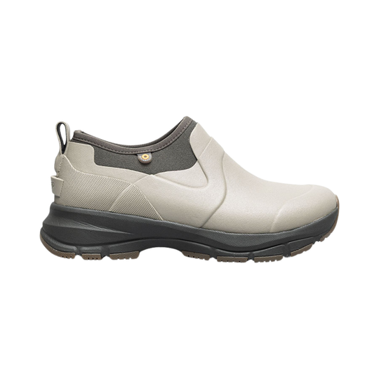 Taupe slip-on ankle boot with a black lug sole and pull tab