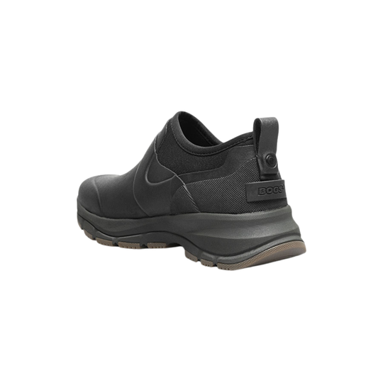 Black slip-on boot with thick lug sole and rear pull tab, shown in side view