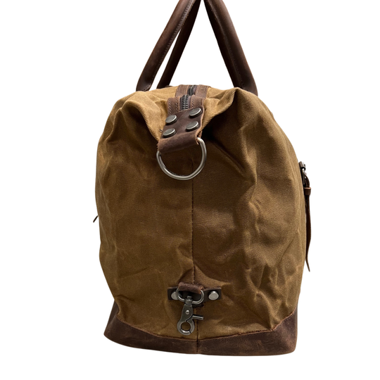 Brown leather backpack with metal rings on a white background