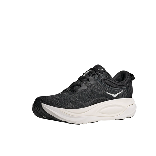 Black athletic shoe with a thick white sole, lace-up front, and low-cut collar
