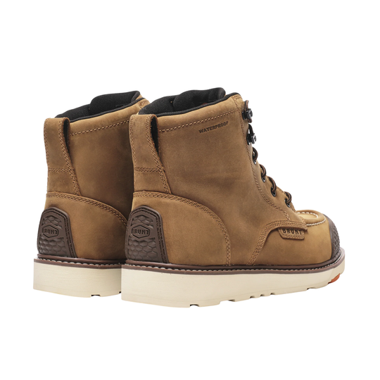 Pair of brown leather boots with white soles on a white background