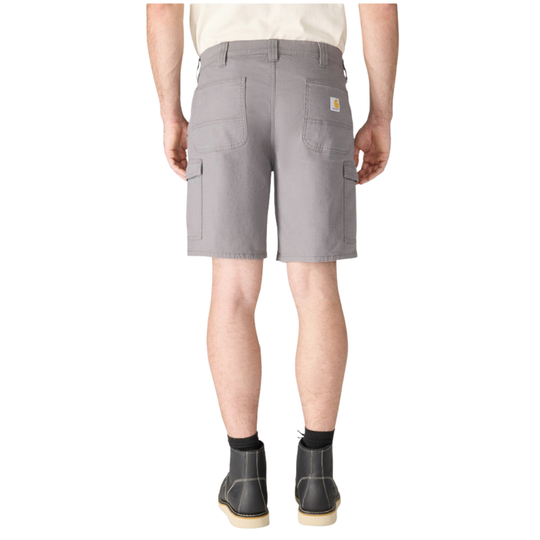 A person shown from the back wearing gray cargo shorts, a light beige shirt, and black ankle boots against a plain white studio background.