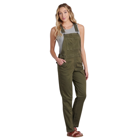Woman wearing green overalls on a white background