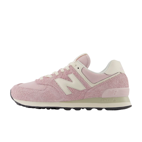 Pink low-top sneaker with cream side logo, white laces, and black sole
