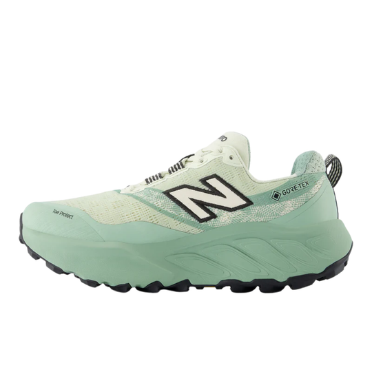 Mint green trail running shoe with black outsole, large side logo, and Gore-Tex marking