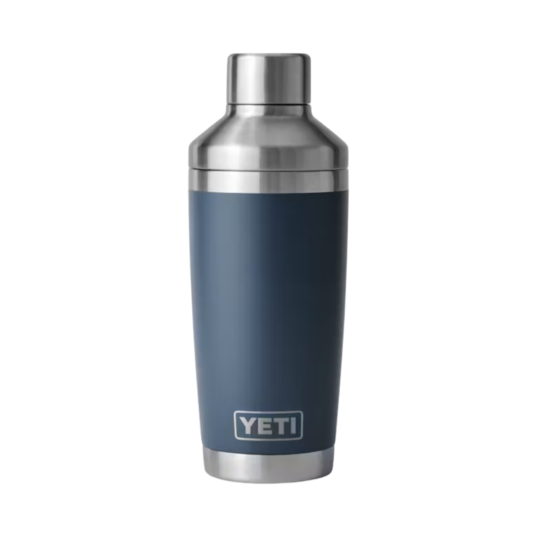 Dark blue insulated shaker with stainless steel lid and YETI logo