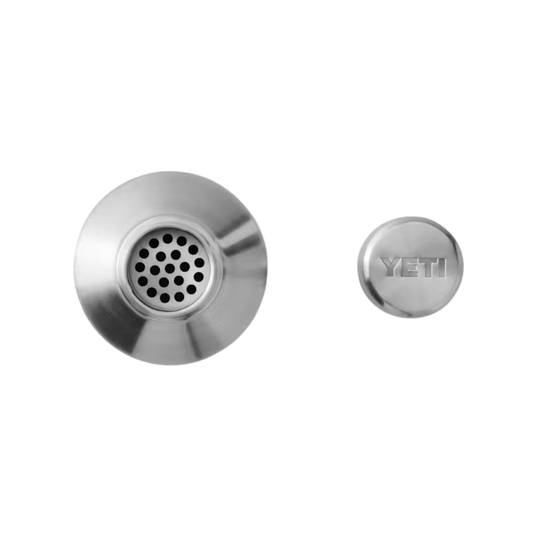 Stainless steel shaker top with perforated strainer and a matching cap embossed “YETI”