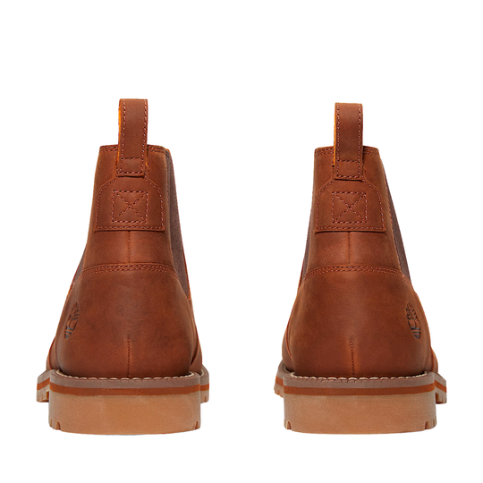 Pair of brown leather boots on a white background