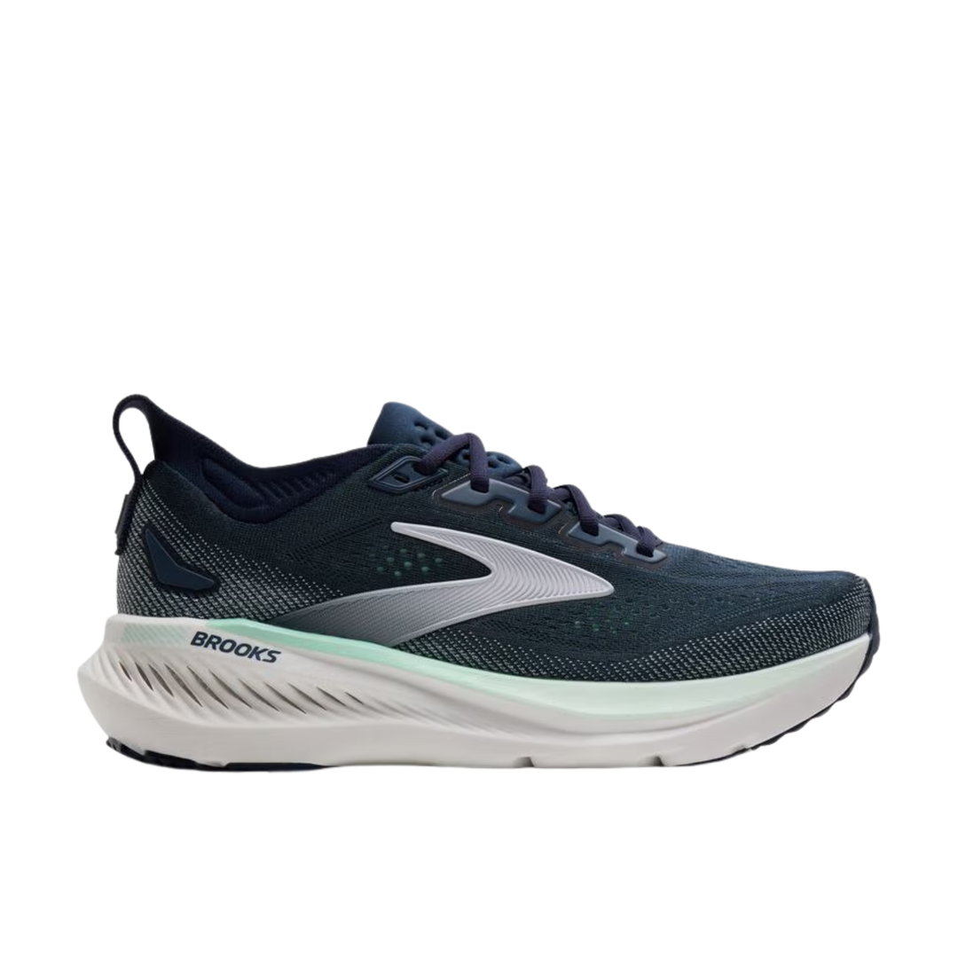 Navy running shoe with white sole on a white background
