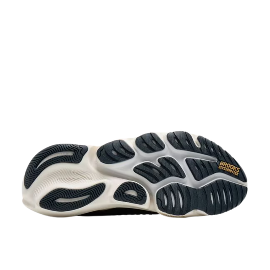 White running shoe outsole with dark tread and Brooks Glycerin Flex branding