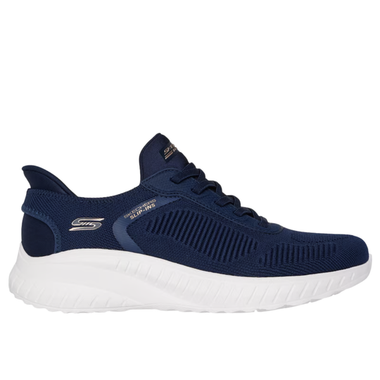 Navy blue athletic shoe with white sole on a white background