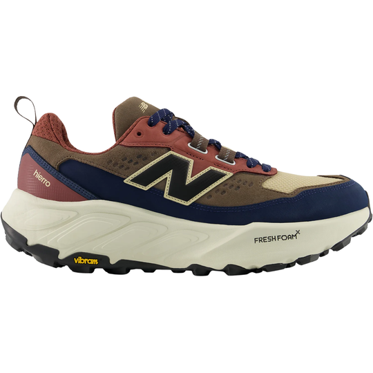 Trail running shoe in brown, navy, red, and cream with a large side logo and lugged sole