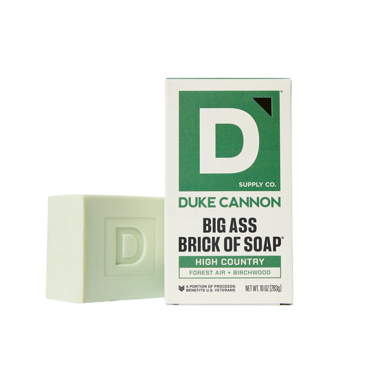 Green and white soap box with a matching soap brick embossed with a D