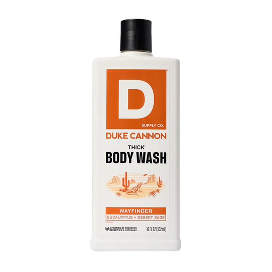 White body wash bottle with orange label, black cap, and bold THICK BODY WASH text