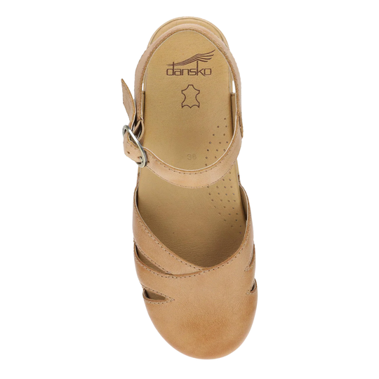 Tan leather closed-toe sandal with an ankle strap, metal buckle, and visible Dansko logo on the insole