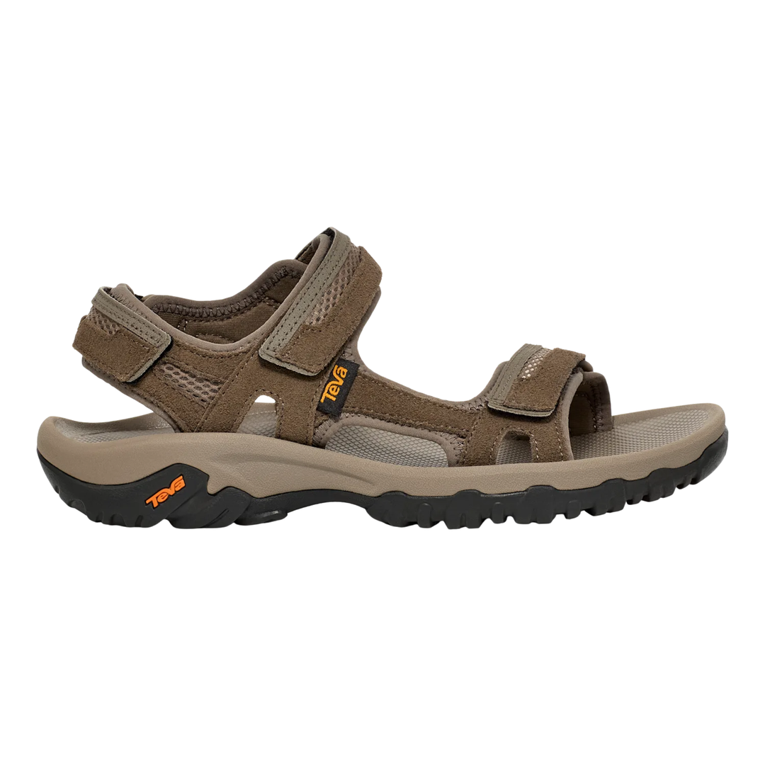 Brown sandals with black soles on a white background