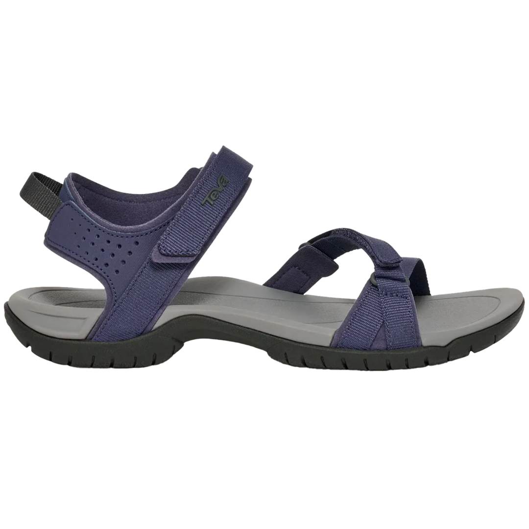 Pair of blue sandals with gray soles on a white background