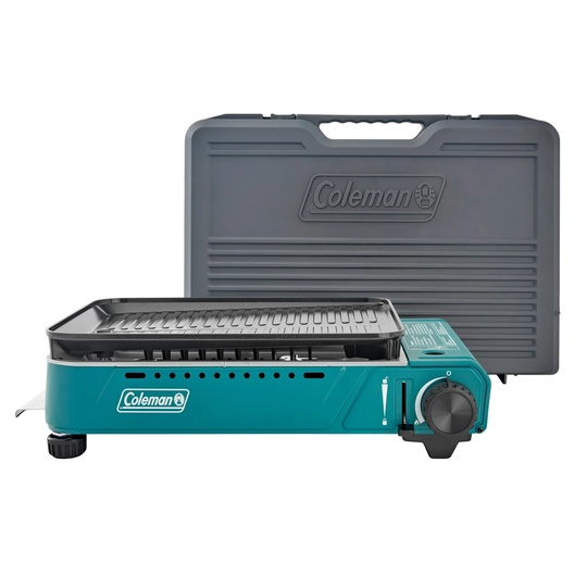 Teal portable butane grill with black griddle plate and gray carrying case