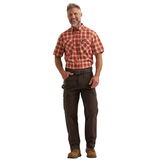 Man wearing a red plaid shirt and brown pants on a white background