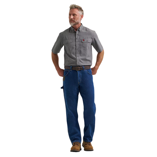 Man wearing a gray shirt and blue jeans on a white background