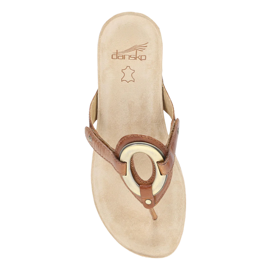 Tan thong sandal with a metallic oval ring and leather straps, viewed from above