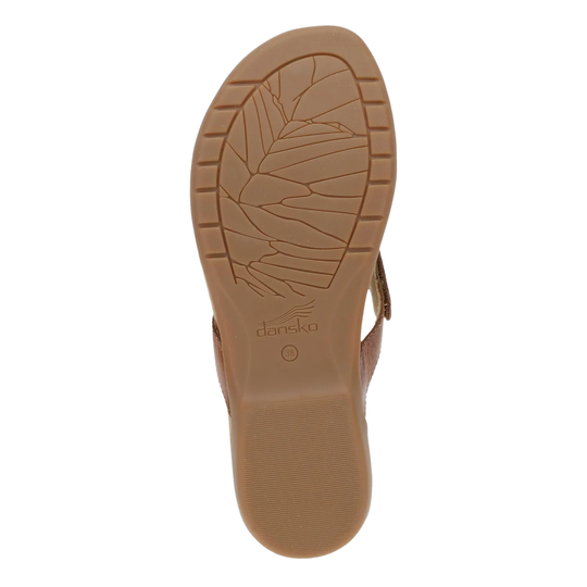 Brown sandal sole with 'dansko' branding on a white background