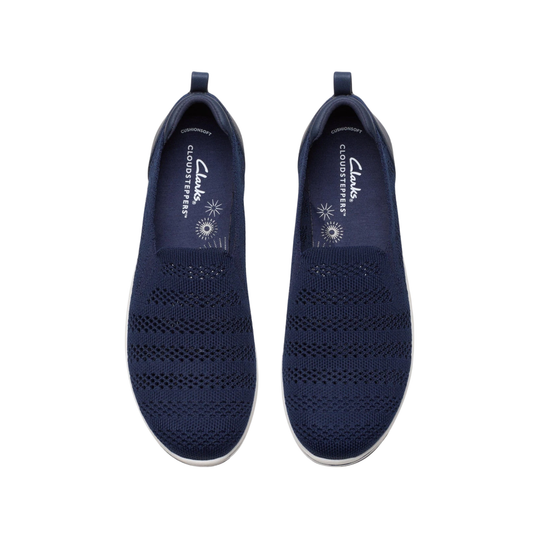 Pair of navy knit slip-on shoes with white soles and pull tabs