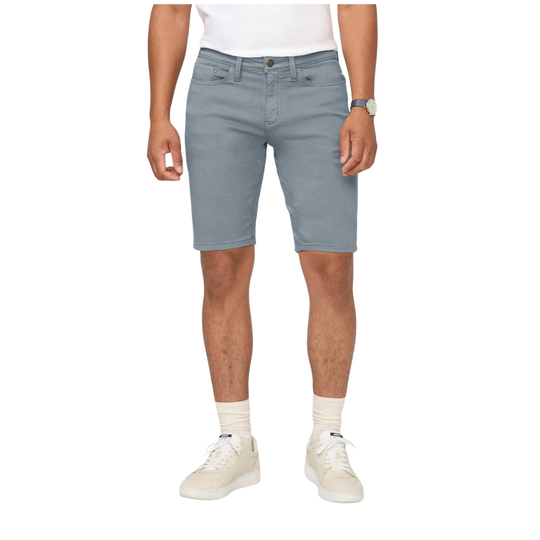 Person wearing light blue denim shorts on a white background