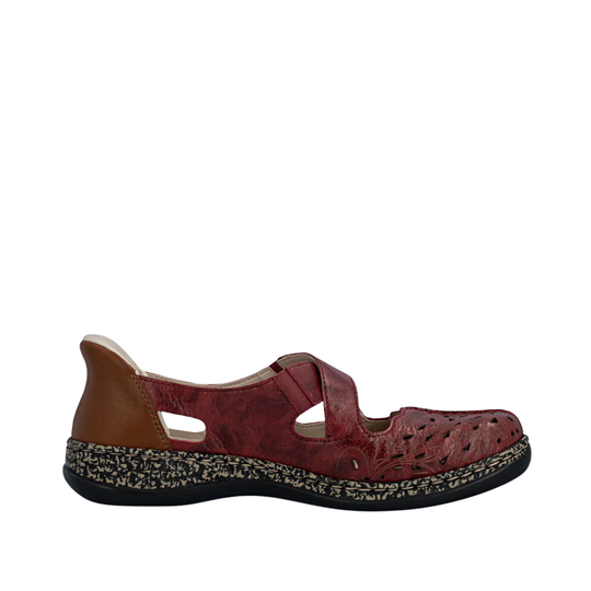 Red sandal with a textured sole on a white background