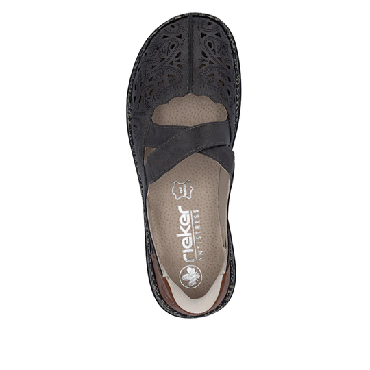 Black closed-toe slip-on sandal with decorative cutouts and crossover straps