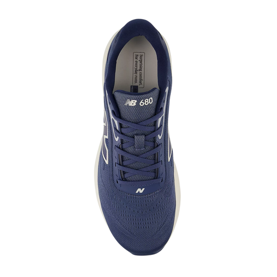 Navy blue running shoe with lace-up front and NB 680 branding on the tongue