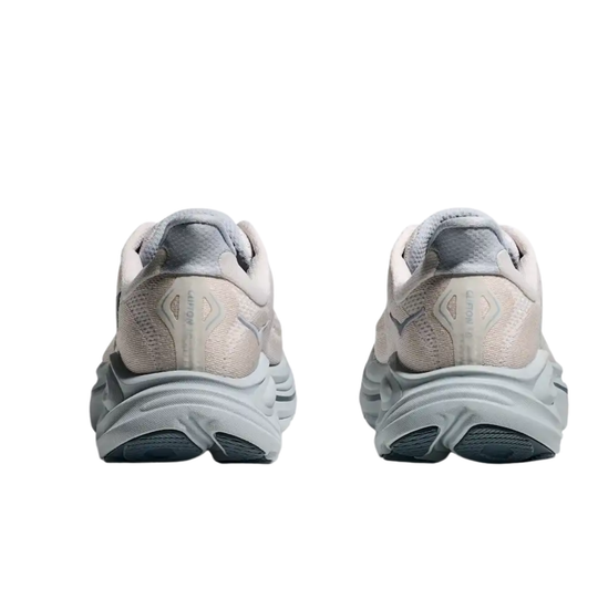 Pair of light gray and white running shoes shown from the heel on a white background