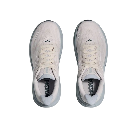 Light gray running shoes with white laces and dark soles, shown from above on a white background