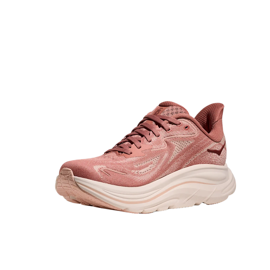 Pink running shoe with chunky white sole and lace-up front on a white background