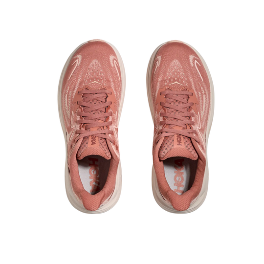 Pair of pink running shoes with mesh uppers, laces, and visible HOKA branding on the insoles