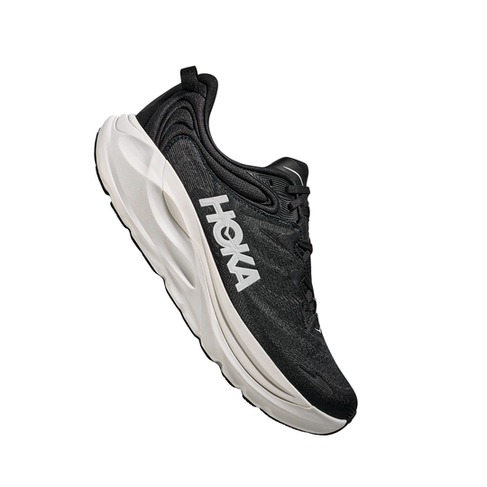 Black athletic shoe with a white cushioned sole and side branding