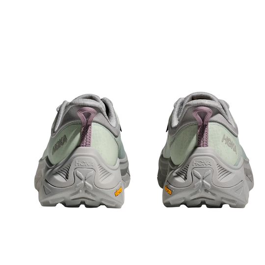 Rear view of gray hiking shoes with pale green panels, purple heel pull tabs, and HOKA logos