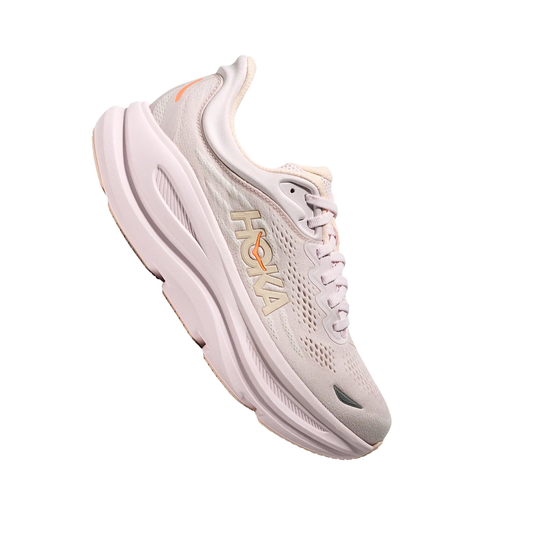Light pink running shoe with orange accents and HOKA branding, shown in side view on a white background