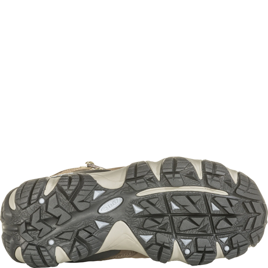 Bottom view of a tan and black hiking boot sole with deep lug tread and Oboz logo