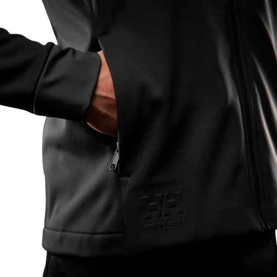 Black zip-front jacket with hand in side pocket and embossed logo near the hem