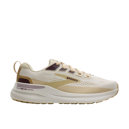 Cream and tan running shoe with maroon accents and a thick white sole